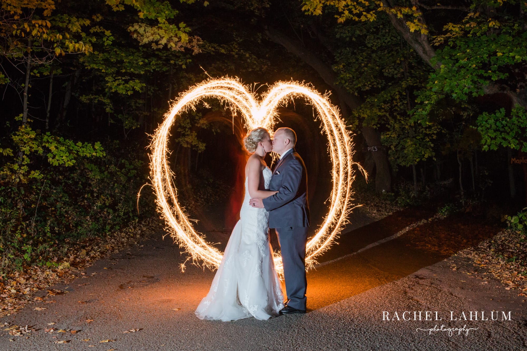 Light painting a heart around a newlywed couple. 