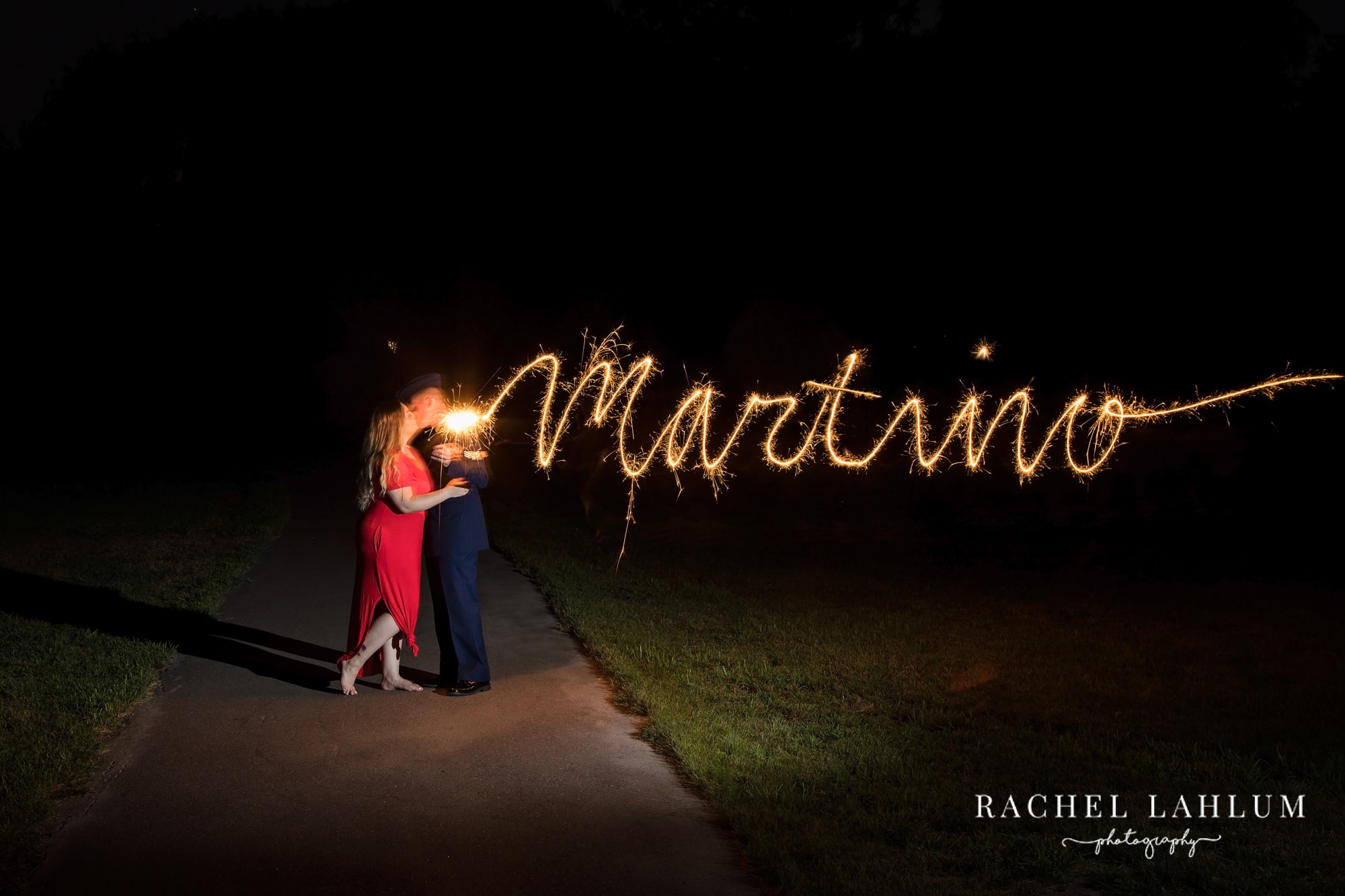 Light painting a newlywed couple's last name with sparklers.  