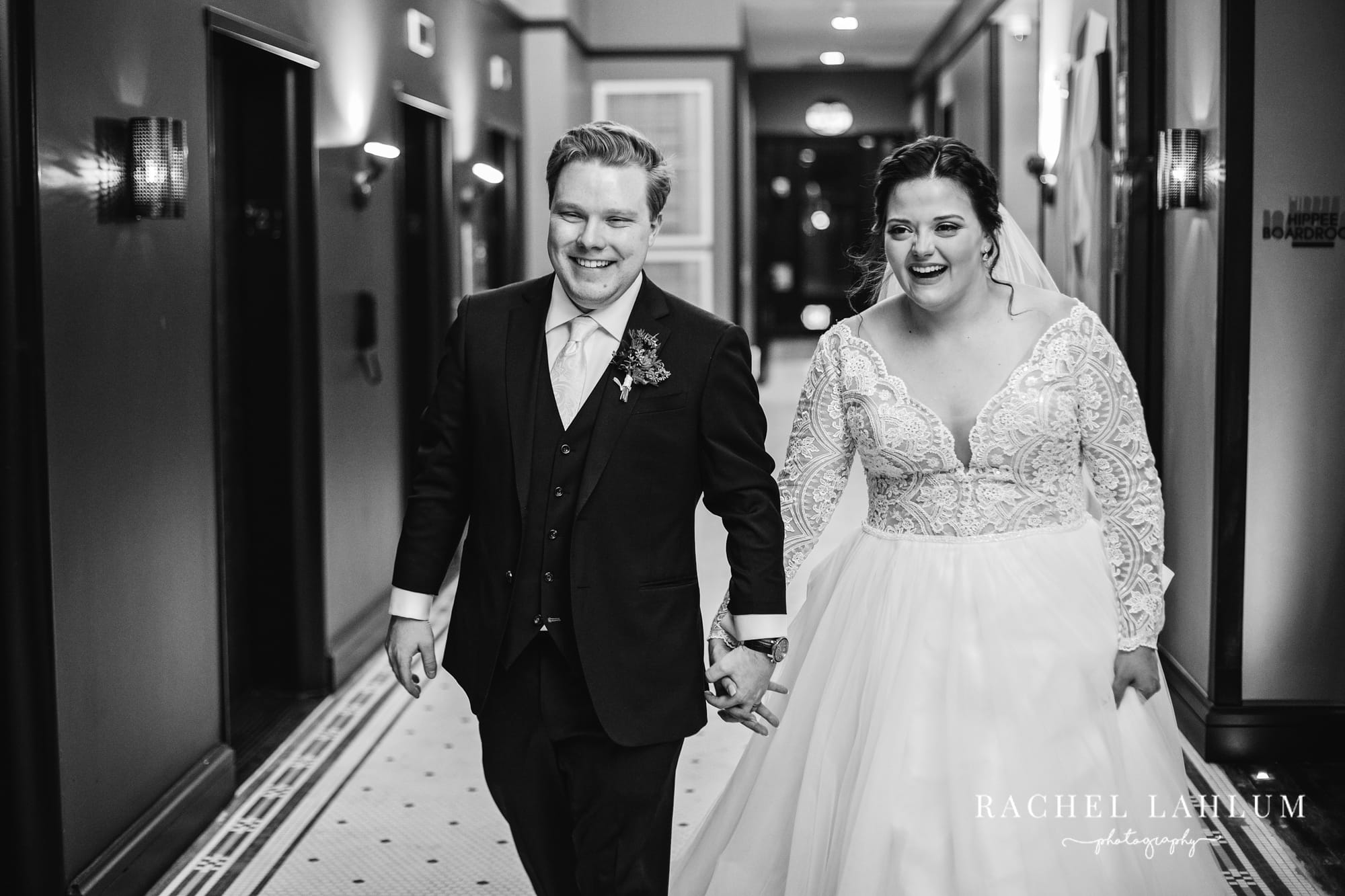 Bride and groom enter wedding reception at Surety Hotel in Des Moines. 