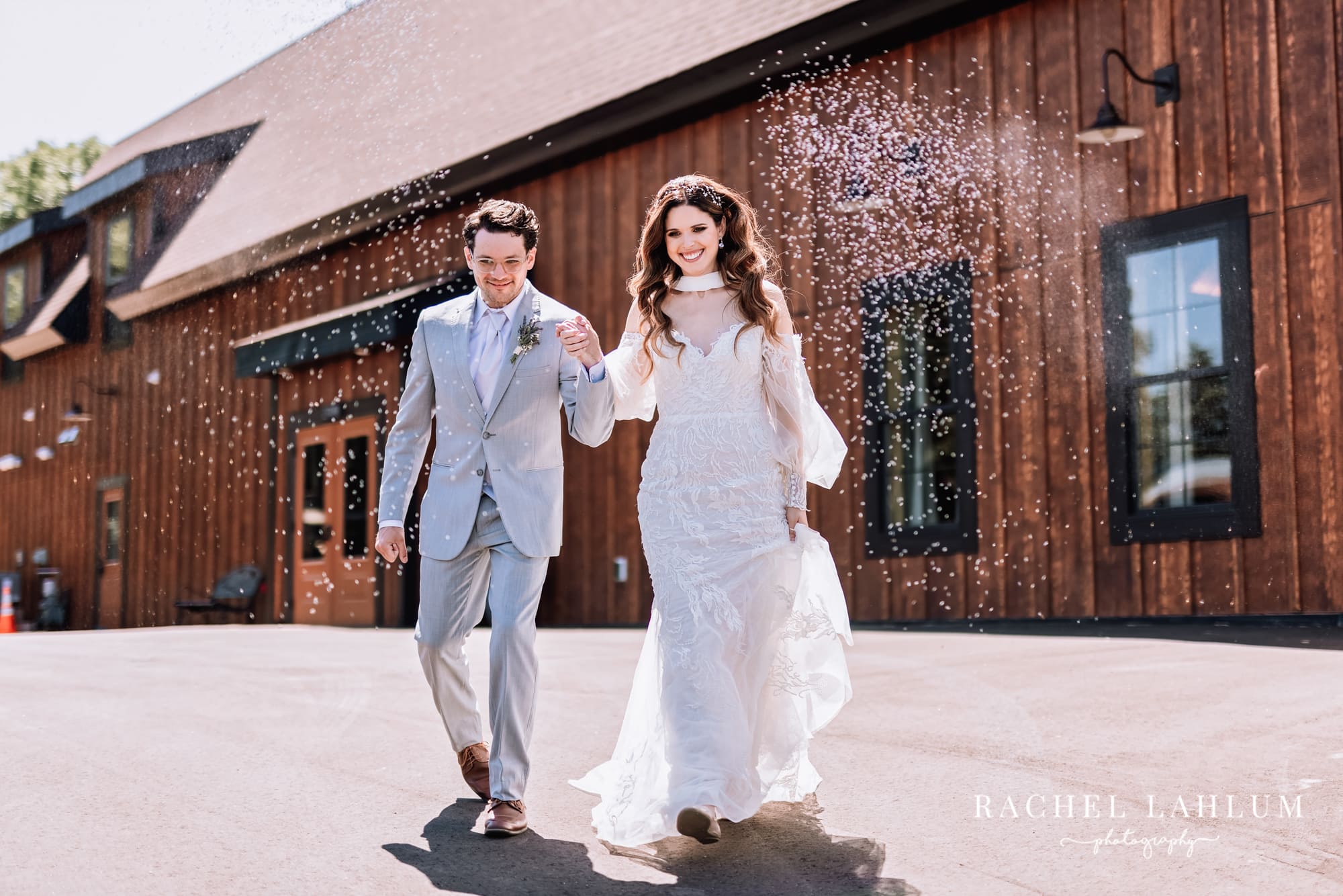 Bride and groom walk out of Circle B Ranch Wedding Venue. 