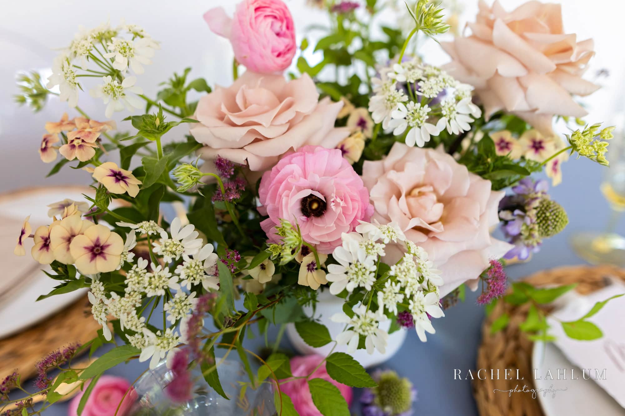 Pink flowers fill up a floral arrangement for a stylized wedding photo shoot in Northeast Minneapolis. 