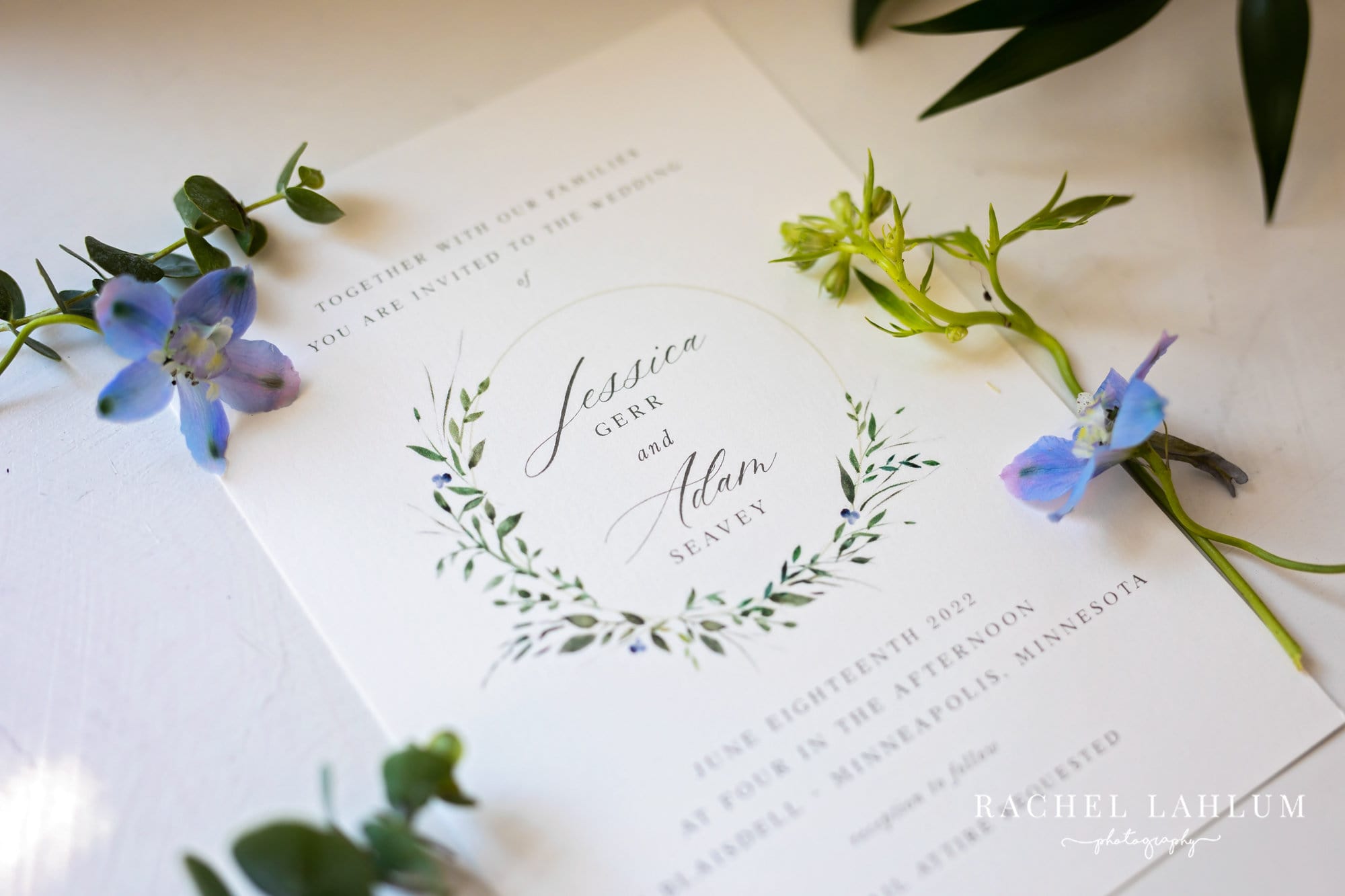 Close up of wedding invitation and flowers for Wedding at The Blaisdell in Minneapolis