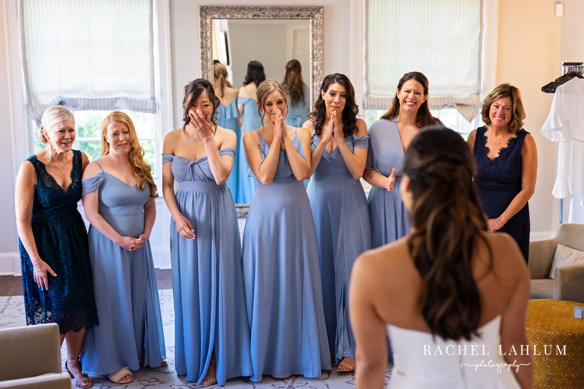 Bridesmaids in blue shed tears after seeing bride in wedding dress at The Blaisdell.