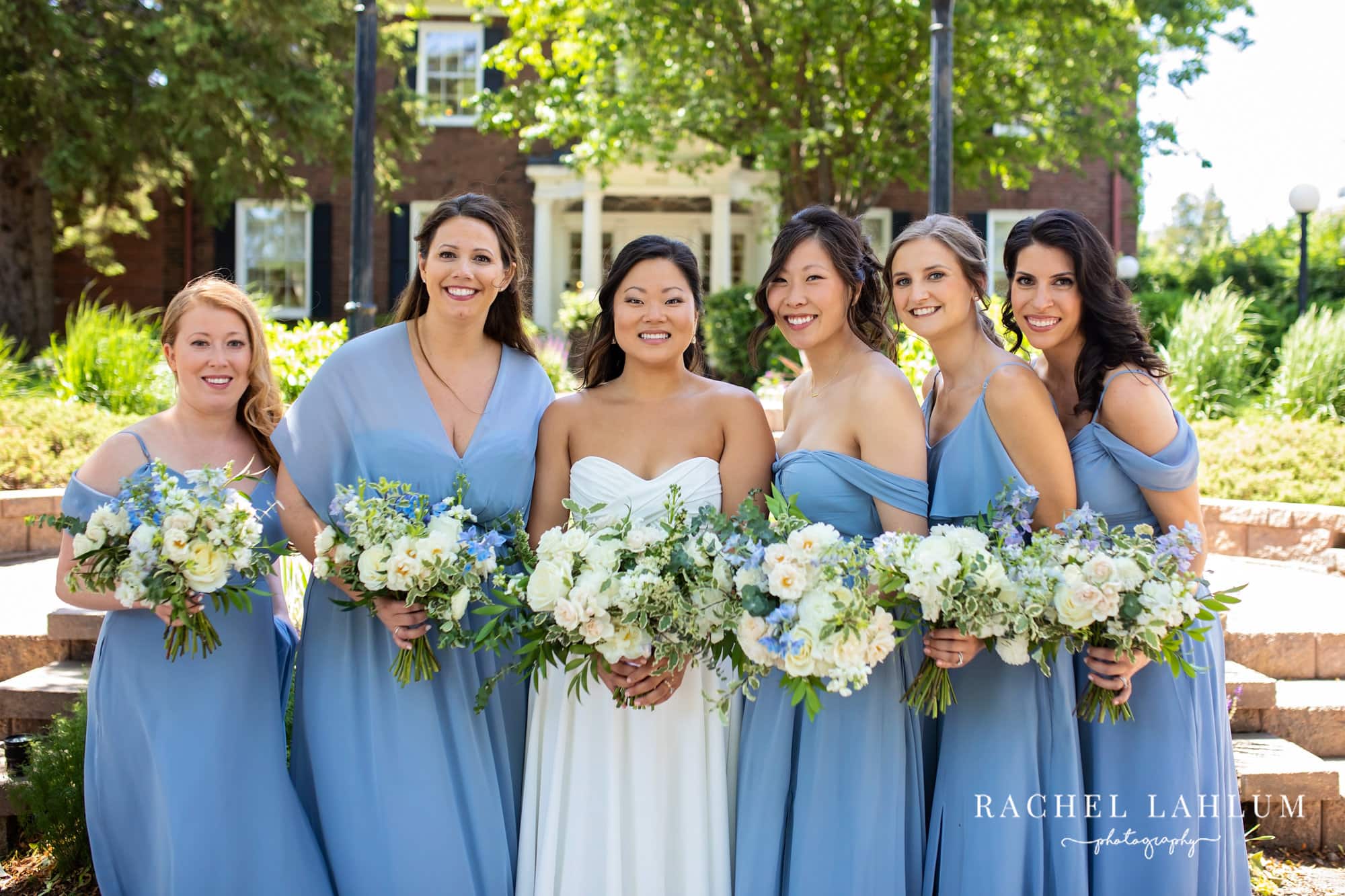Bride and bridesmaids pose together before wedding ceremony at The Blaisdell.