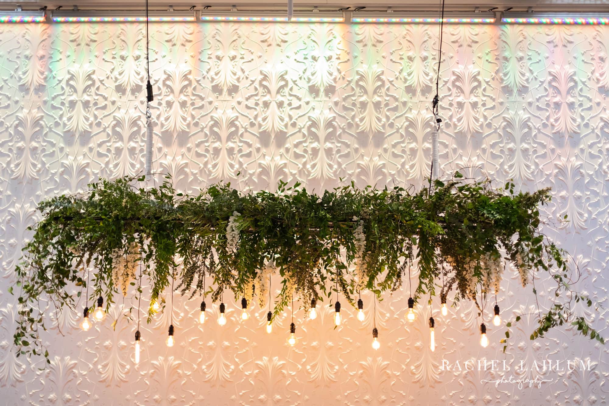Hanging greenery and lights decoration above the reception space at The Blaisdell.
