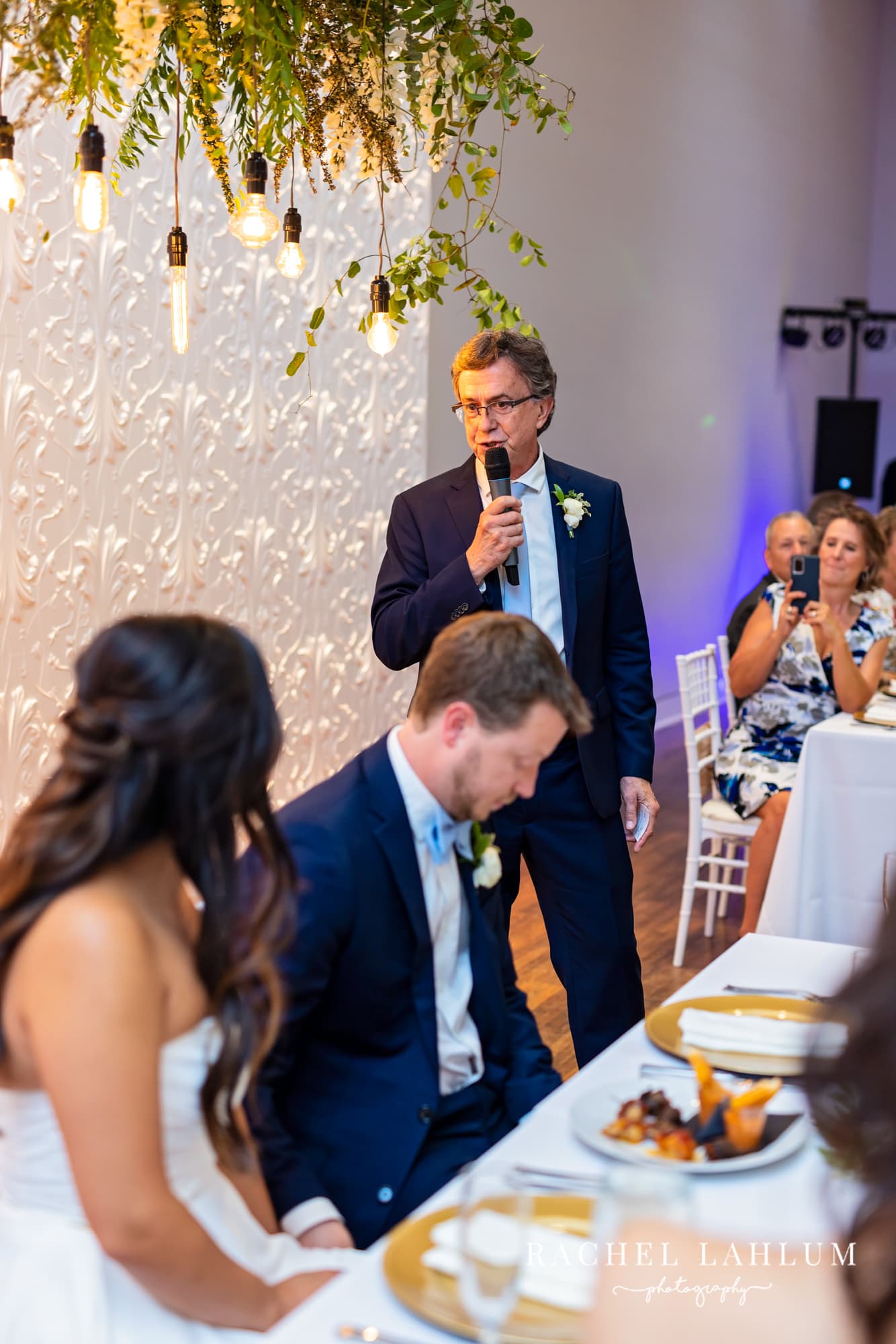Parent gives speech before a toast during wedding reception at The Blaisdell.