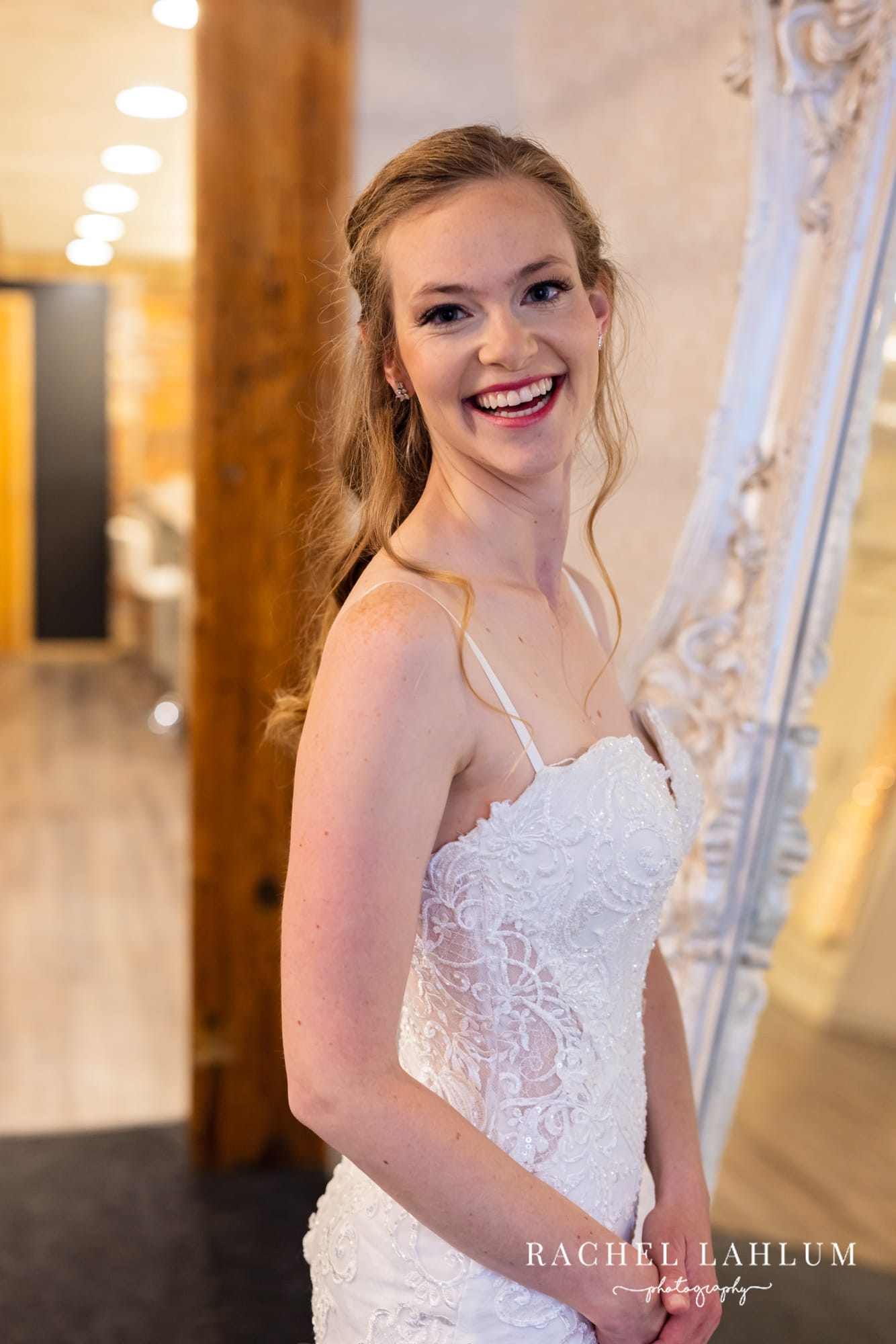 Bride smiles for a portrait before wedding at The Minneapolis Event Center. 