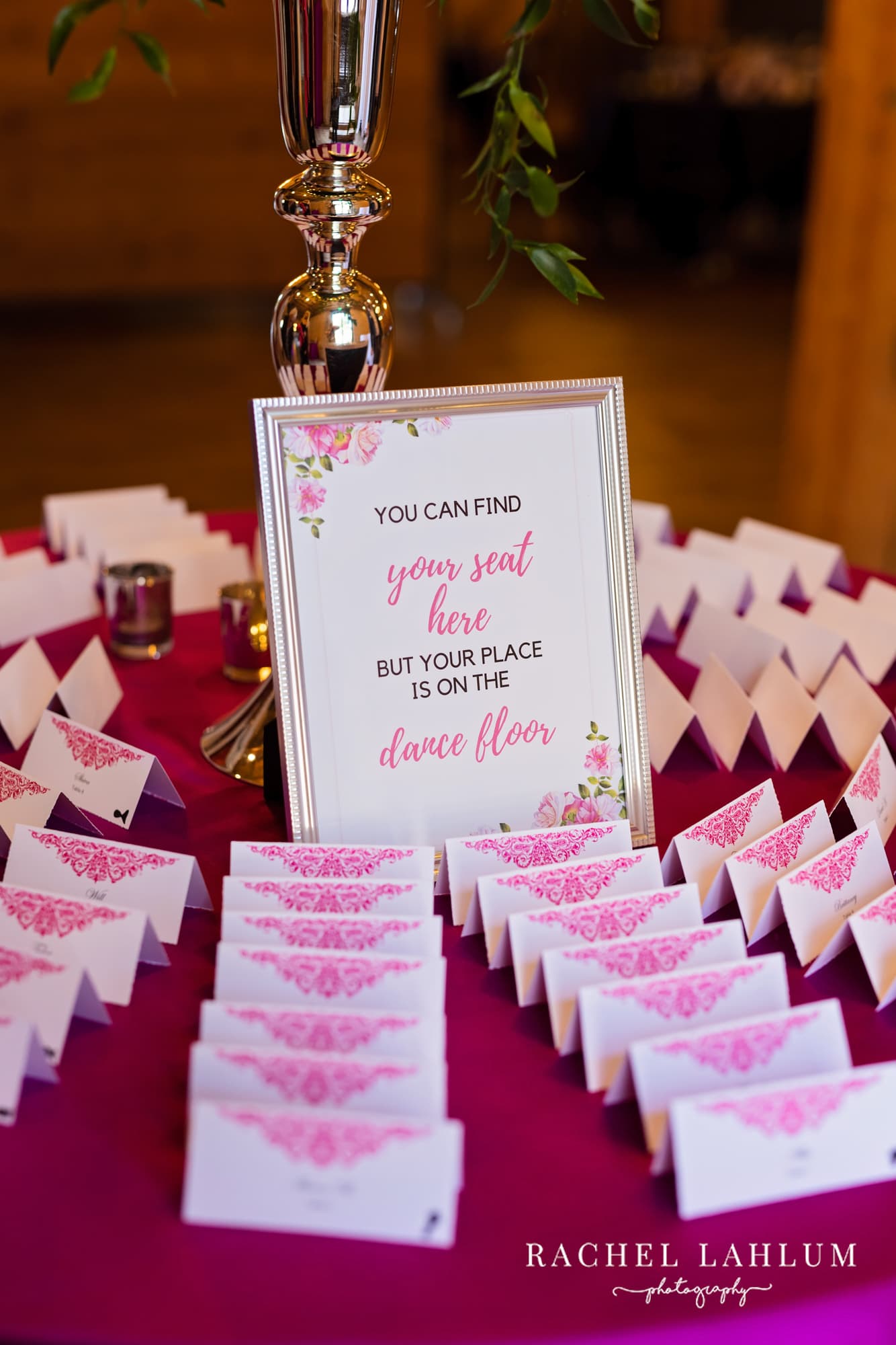 Place cards surround a sign at wedding reception at The Minneapolis Event Center.