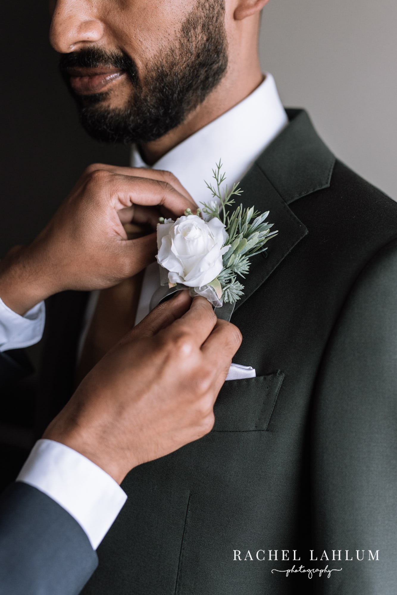 Close up of groom’s boutonnière. 