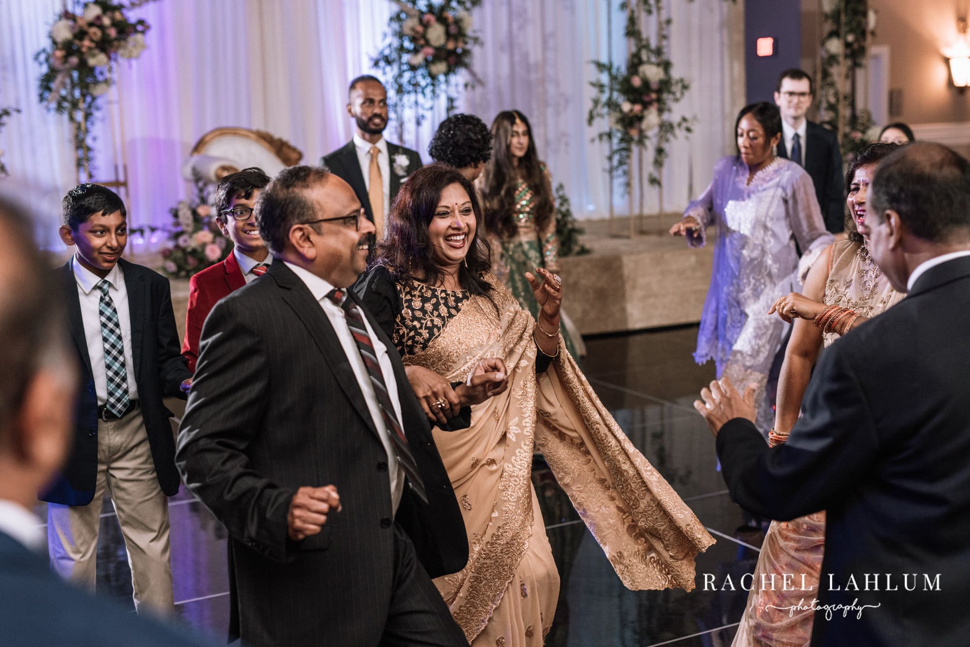 Wedding guests dance during Walima celebration at The Intercontinental in St. Paul, MN.