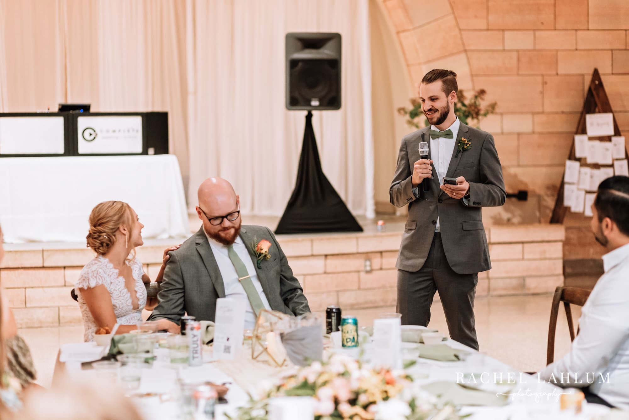 Best man gives speech during wedding reception at Harriet Island Pavilion in St. Paul, Minnesota.